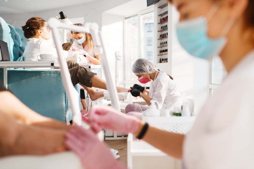 Two girlfriends, pedicure process in beauty salon